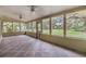 Enclosed sunroom showcasing a tile floor and scenic outdoor views at 2911 Pemberton Creek Dr, Seffner, FL 33584