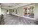 Relaxing covered patio with tiled floor, ceiling fans and view to the backyard at 2911 Pemberton Creek Dr, Seffner, FL 33584