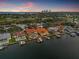 Waterfront home featuring a private dock and pool, offering stunning city views at sunset at 301 Bayview Ne Dr, St Petersburg, FL 33704