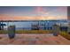 A backyard patio with views of the intercoastal waterway and a boat dock at 301 Bayview Ne Dr, St Petersburg, FL 33704