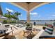 The home features a stunning outdoor living area with a covered patio, pool and waterfront views at 301 Bayview Ne Dr, St Petersburg, FL 33704