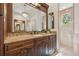 Bathroom vanity featuring custom wood cabinets, granite countertops, and designer fixtures at 301 Bayview Ne Dr, St Petersburg, FL 33704