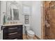 Charming bathroom showcases elegant fixtures, a vanity with storage, and a tastefully decorated shower area at 301 Bayview Ne Dr, St Petersburg, FL 33704