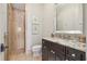 Well-lit bathroom featuring modern sink, shower with glass door, and granite countertop at 301 Bayview Ne Dr, St Petersburg, FL 33704