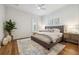Comfortable bedroom featuring ample natural light, neutral tones, and hardwood floors at 301 Bayview Ne Dr, St Petersburg, FL 33704