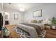 Spacious bedroom boasts hardwood floors, neutral walls, and a stylish rug, creating a serene and inviting atmosphere at 301 Bayview Ne Dr, St Petersburg, FL 33704