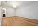 Expansive empty bedroom with gorgeous wood flooring and an ensuite bathroom at 301 Bayview Ne Dr, St Petersburg, FL 33704