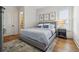 Cozy bedroom with warm lighting, stylish decor, and wood floors at 301 Bayview Ne Dr, St Petersburg, FL 33704