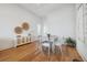 Cozy dining area with hardwood floors and a modern sideboard at 301 Bayview Ne Dr, St Petersburg, FL 33704