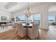 Dining area with water views, a modern chandelier, and seating for six at 301 Bayview Ne Dr, St Petersburg, FL 33704
