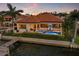 Charming waterfront home with a pool, private dock, and fenced yard at 301 Bayview Ne Dr, St Petersburg, FL 33704