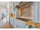 A gourmet kitchen with granite counters and stainless steel appliances at 301 Bayview Ne Dr, St Petersburg, FL 33704