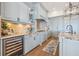 A gourmet kitchen with granite counters, stainless steel appliances, and a wine cooler is perfect for entertaining at 301 Bayview Ne Dr, St Petersburg, FL 33704
