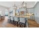 Gourmet kitchen with a large island, granite countertops, pendant lighting, and modern appliances at 301 Bayview Ne Dr, St Petersburg, FL 33704
