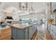 A gourmet kitchen island offers open sight lines to the living area and gorgeous waterfront views at 301 Bayview Ne Dr, St Petersburg, FL 33704