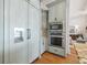 A gourmet kitchen has built-in stainless steel oven and microwave at 301 Bayview Ne Dr, St Petersburg, FL 33704