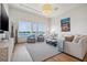 Elegant living room with water views, ample seating and neutral tones at 301 Bayview Ne Dr, St Petersburg, FL 33704