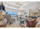 Open-concept living area with water views, stylish seating, and elegant lighting fixtures at 301 Bayview Ne Dr, St Petersburg, FL 33704