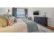 Bright main bedroom with sitting area offers water views and access to luxurious ensuite at 301 Bayview Ne Dr, St Petersburg, FL 33704