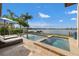 The backyard features a pool, hot tub and gorgeous waterfront views at 301 Bayview Ne Dr, St Petersburg, FL 33704