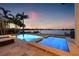Inviting outdoor pool with waterfront views perfect for relaxation and entertaining at 301 Bayview Ne Dr, St Petersburg, FL 33704