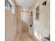 Walk-in shower with custom tile work, rainfall showerhead, and built-in seating niche at 301 Bayview Ne Dr, St Petersburg, FL 33704