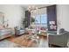 Bedroom sitting area with water views, stylish decor and comfortable seating at 301 Bayview Ne Dr, St Petersburg, FL 33704