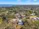 Aerial view of a home nestled among lush trees in a tranquil and serene neighborhood at 310 55Th S Ave, St Petersburg, FL 33705