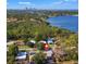 Aerial view of a house near the water with lush landscaping and tranquil and serene surroundings at 310 55Th S Ave, St Petersburg, FL 33705