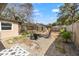 Expansive backyard featuring a fire pit with chairs, a cozy patio and landscaped gravel at 310 55Th S Ave, St Petersburg, FL 33705