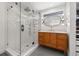 Modern bathroom featuring a glass shower, sleek vanity with ample storage, and stylish fixtures at 310 55Th S Ave, St Petersburg, FL 33705