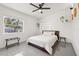 Bright bedroom featuring a large bed, hardwood floors, and modern decor, creating a cozy and inviting space at 310 55Th S Ave, St Petersburg, FL 33705