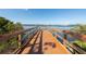 Long wooden dock offering stunning views of the water and a glimpse of the distant shoreline at 310 55Th S Ave, St Petersburg, FL 33705