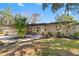 Inviting home featuring a well-manicured front yard, fresh landscaping, and charming curb appeal at 310 55Th S Ave, St Petersburg, FL 33705