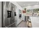 Kitchen with stainless steel appliances and a large refrigerator at 310 55Th S Ave, St Petersburg, FL 33705