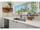 Bright kitchen featuring a stainless steel sink and a window with a view of the outdoors at 310 55Th S Ave, St Petersburg, FL 33705