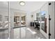Bright home office with ample natural light, stylish desk, and access to a screened-in patio at 310 55Th S Ave, St Petersburg, FL 33705
