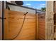 Outdoor shower featuring wood plank walls and modern fixtures, perfect for rinsing off after a swim at 310 55Th S Ave, St Petersburg, FL 33705