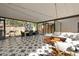 Beautiful outdoor patio with tile, a dining area, a comfortable seating area and lovely backyard views at 310 55Th S Ave, St Petersburg, FL 33705
