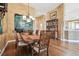 Cozy dining area showcasing a dark wood table, chandelier, and decorative wall art, perfect for meals at 3402 Stonebridge Trl, Valrico, FL 33596