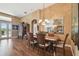 An elegant dining room with hardwood floors and a chandelier creates a perfect dinner setting at 3402 Stonebridge Trl, Valrico, FL 33596