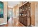 Spacious hallway featuring hardwood floors, decorative furniture, and seamless flow into other rooms at 3402 Stonebridge Trl, Valrico, FL 33596