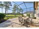 Outdoor patio featuring brick pavers, ample seating, and a view of the well-manicured golf course at 3402 Stonebridge Trl, Valrico, FL 33596