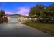 Charming single-story home with attached garage, lush lawn, and mature tree at 3485 Floral Dr, Largo, FL 33771