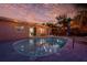 Private pool with lighting that provides a serene setting for relaxation and evening swims at 3485 Floral Dr, Largo, FL 33771
