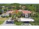 An elevated view showing lush trees and parking areas around this lovely condo building at 3505 Tarpon Woods Blvd # P404, Palm Harbor, FL 34685