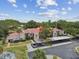 An elevated view showing lush trees and parking areas around this lovely condo building at 3505 Tarpon Woods Blvd # P404, Palm Harbor, FL 34685