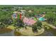 An aerial view showcasing pool and ponds surrounding this peaceful condo community at 3505 Tarpon Woods Blvd # P404, Palm Harbor, FL 34685