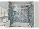 Tiled shower-tub combination with glass door and decorative accent tiles at 3505 Tarpon Woods Blvd # P404, Palm Harbor, FL 34685