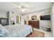 This bedroom boasts an elegant ceiling fan, soft colors, and a luxurious Persian rug at 3505 Tarpon Woods Blvd # P404, Palm Harbor, FL 34685